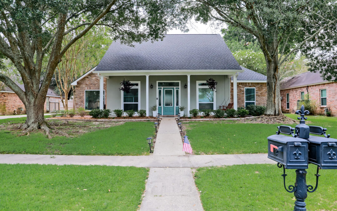 baton rouge home insurance cost | A front view of an Acadian renovated home with columns, sidewalks and a colorful front door recently purchased with the changing real estate market